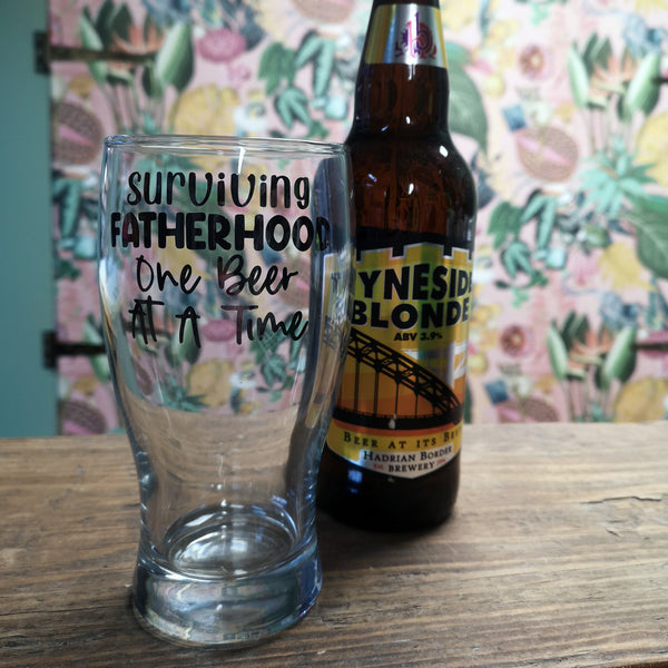 'Surviving Fatherhood, One Beer at a Time' Pint Glass